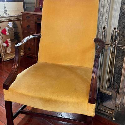 Yellow velvet solid wood fireside chair. 