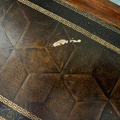 scratch in leather on game table. 