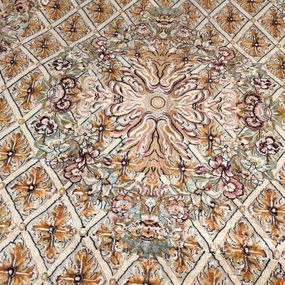 ANTIQUE PATTERN CARPET | Central medallion on a patterned field within floral and foliate borders - l. 126 x w. 94 in. 