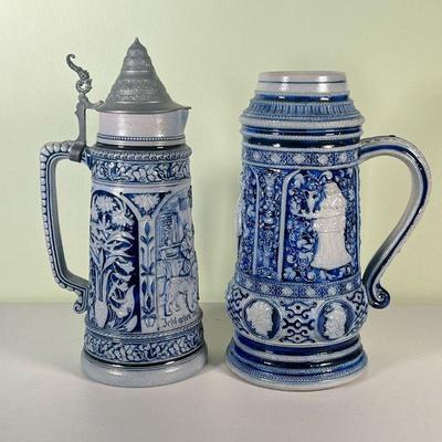 (2pc) METTLACH STEINS | A pair of large blue and grey Mettlach steins; one 2L lidded stein, the other slightly larger without a lid; both...