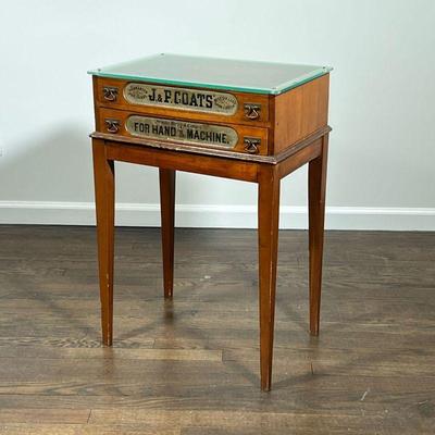VINTAGE DISPLAY TABLE | Spool display side table with glass top and two glass drawers to display contents; drawers read 