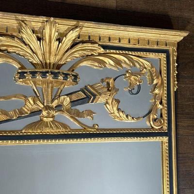 BLACK & GILT FEDERAL MIRROR | Over mantel wall mirror with black and gold decoration crested top with scroll and leaf device carved in...