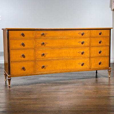 SCHMEIG & KOTZIAN LONG DRESSER | Tiger maple chest of drawers with concave front, inlaid in contrasting woods, having four graduated...