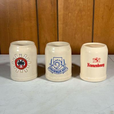 (3pc) VINTAGE BEER MUGS | Three ceramic European .5 L beer mugs; Gruibinger Bier, AFRC Garmisch Ski Austria, and Kronenbourg - w. 5 x h....