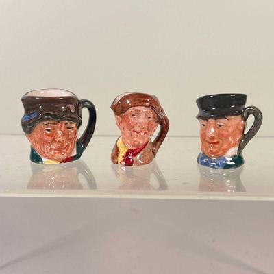 (3pc) MINIATURE TOBY JUGS | Three very small Toby jugs by Royal Doulton; each depicts a man with hat, marked on bottoms - l. 1.5 x w. 1 x...