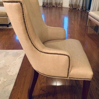 Linen upholstered arm chair with nailhead details