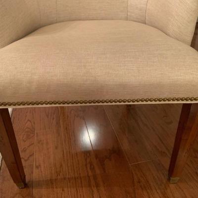 Linen upholstered arm chair with nailhead details