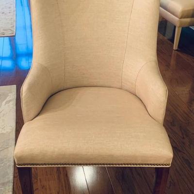Linen upholstered arm chair with nailhead details