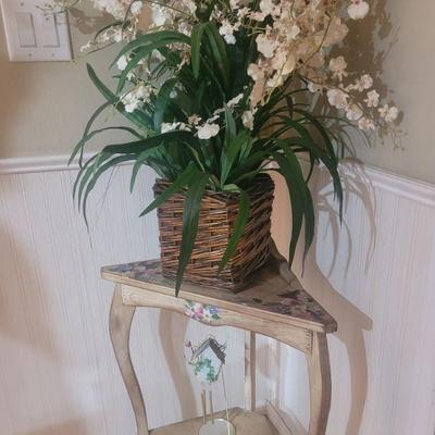 Corner table and a nice artificial flower arrangement