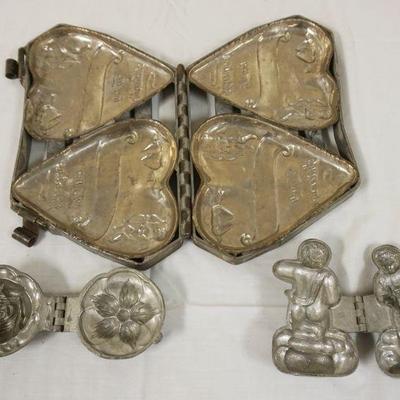 1055	ANTIQUE CHOCOLATE MOLDS, 3 PIECE LOT INCLUDES LARGE VALENTINE'S DOUBLE HEART, APPROXIMATELY 7 IN X 11 IN
