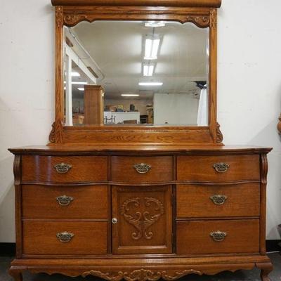 1180	LEXINGTON OAK 7 DRAWER CHEST WITH 1 DOOR AND BEVELED MIRROR TOP, APPROXIMATELY 64 IN X 21 IN X 81 IN H
