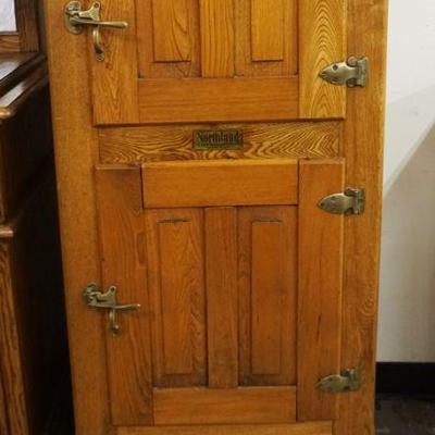 1179	ANTIQUE NARROW OAK *NORTH LAND* 2 DOOR ICE BOX WITH PANELED SIDE, APPROXIMATELY 17 IN X 21 IN X 51 IN H
