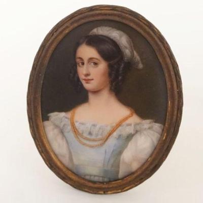 1030	ANTIQUE OVAL PAINTING OF YOUNG LADY ON PORCELAIN IN BRASS FRAME, APPROXIMATELY 3 IN X 4 IN
