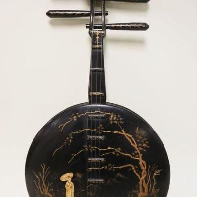 1023	BLACK LACQUERED ASIAN WALL HANGING IN THE FORM OF A BANJO, APPROXIMATELY 12 IN X 24 IN
