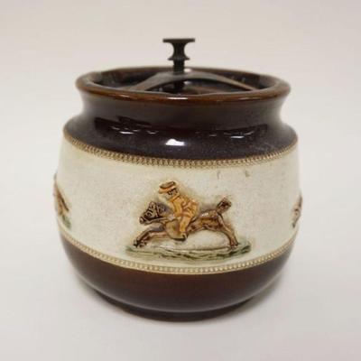 1026	BOURNE DERBY ANTIQUE POTTERY TOBACCO JAR W/RAISED SCENES OF A FOX HUNT IN CENTER BAND, APPROXIMATELY 6 IN HIGH
