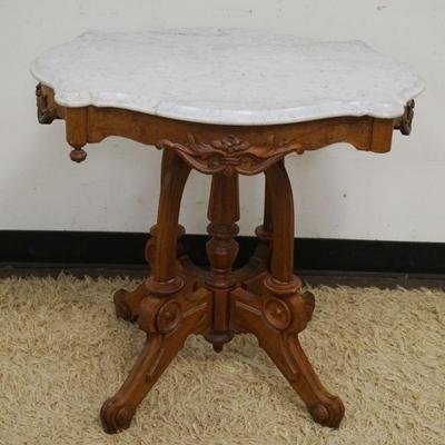 1197	ANTIQUE WALNUT VICTORIAN TURTLE MARBLE TOP PARLOR TABLE, SOME CHIPS TO EDGES, APPROXIMATELY 30 IN X 21 IN X 28 IN H
