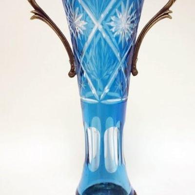 1285	CONTEMPORARY BLUE CUT TO CLEAR VASE WITH METAL BASE AND HANDLED TOP, APPROXIMATELY 13 IN H
