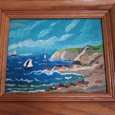 Shoreline painting with cliffs & sailboat