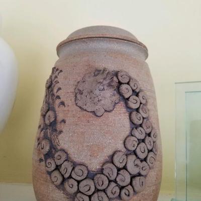Stoneware jar with whimsical applied decoration