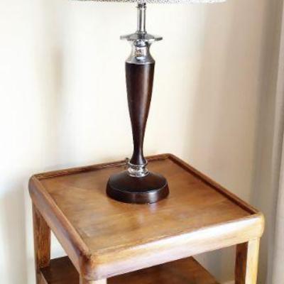 Square wooden accent table with wood and chrome lamp with shade
