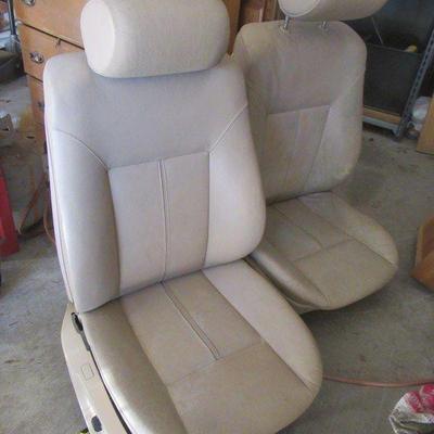TWO LEATHER POWER BUCKET SEATS THAT APPEAR TO BE FROM A CORVETTE