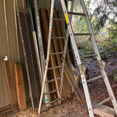 Assorted ladders, lumber, wood, and other construction supplies