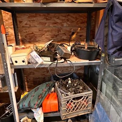 Assorted tools, nuts, bolts, camping supplies, and more