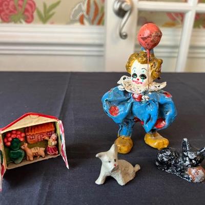 Clown $10. Black cast metal dog $12. Grey cast metal dog $9. Diorama $5