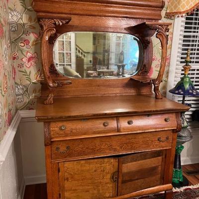 Tiger Oak buffet and mirrored shelf $295
Veneer needs to be glued on front corners, veneer missing on right door