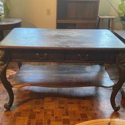 Ornate Library Table with lion head curved legs