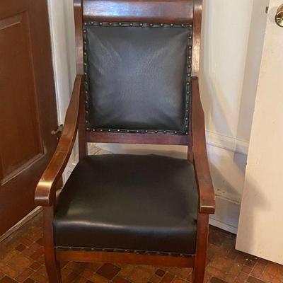 black upholstered arm chair