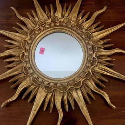 Gold Sun mirror, looks great complimenting any room.