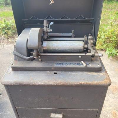 This is an old Edison, Ediphone. It has two drawers, one has some old wax cones in the cardboard and some empty cardboard holders. The...