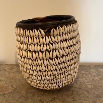 African basket with cowrie shells