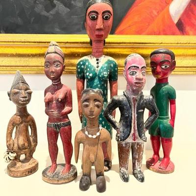 group of African and Mexican folk art statues