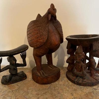 a group of African sculptures