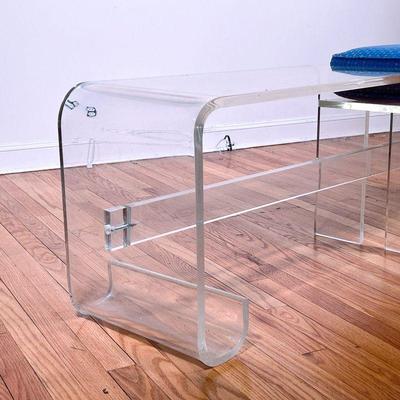 KAGAN STYLE LUCITE BENCH | Having a single seat with an upholstered cushion next to an extended low form table, in the manner of Vladimir...