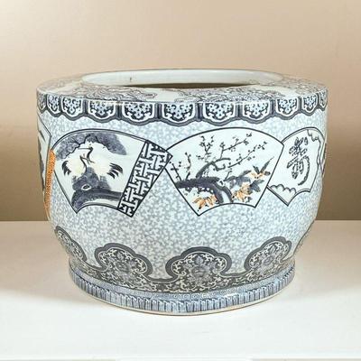 CHINESE CERAMIC PLANTER | Blue and white large Chinese porcelain planter with various scenes in reserves and mountainous motifs with rust...