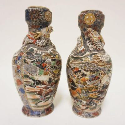 1094	PAIR OF ASIAN POTTERY VASES W/WARRIORS & RELIEF DRAGON WRAPPED AROUND NECK OF VASES, APPROXIMATELY 7 1/2 IN
