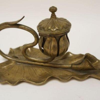 1037	ART NOUVEAU BRASS INKWELL IN THE FORM OF A TULIP ON A LARGE LEAF, MISSING GLASS INSERT, APPROXIMATELY 10 IN X6 IN X 6 IN HIGH
