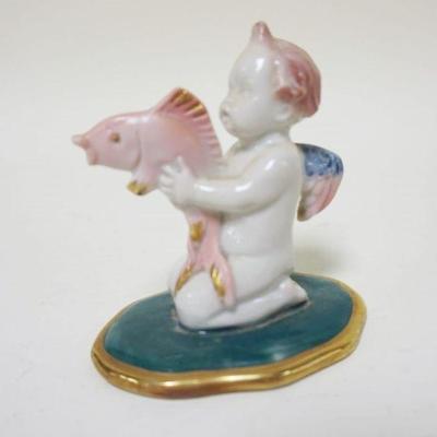 1092	EMS PORCELAIN FIGURINE OF CHERUB HOLDING FISH, APPROXIMATELY 4 IN HIGH
