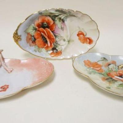 1065	3 HAND PAINTED OVAL CHINA TRAYS W/FLOWERS, LARGEST APPROXIMATELY 7 IN X 11 IN
