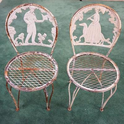 1162	PAIR OF METAL GARDEN CHAIRS W/CAST METAL COURTING SCENES
