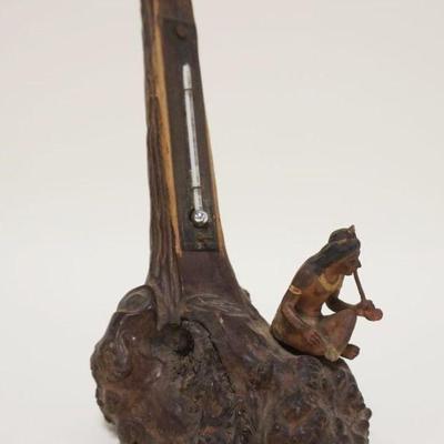 1032	WOOD CARVED AMERICAN NATIVE SMOKING A PIPE AT BASE OF TREE W/THERMOMETER, APPROXIMATELY 7 IN HIGH
