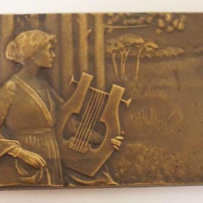 1018	BRONZE GENEVIEVE GRANGER PLAQUE OF WOMAN W/LYRE, ENGRAVED ON REVERSE FLORENCE WATTS W/EMBOSSED TREES, APPROXIMATELY 2 IN X 2 3/4 N
