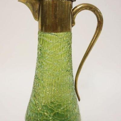 1105	ART GLASS GREEN IRIDESCENT PITCHER W/HINGED LID, METAL COLLAR AND HANDLE, APPROXIMATELY 11 1/2 IN HIGH

