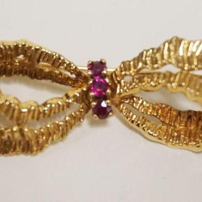 1151	TIFFANY & CO 18K GOLD BOW PIN W/RUBIES IN CENTER 5 DWT

