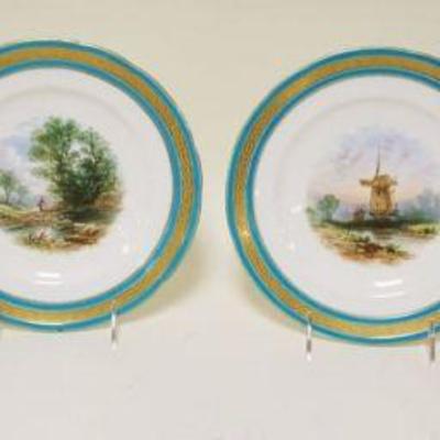 1057	LOT OF 4 HAND PAINTED DISHES W/BLUE & GILT DECORATED BORDER, SCENES OF WINDMILLS & STREAMS, APPROXIMATELY 9 1/4 IN
