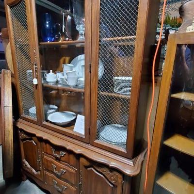 wire over glass china hutch. 2 pieces. Currently housed in our storage and is available to be seen or picked up from there. Asking $300