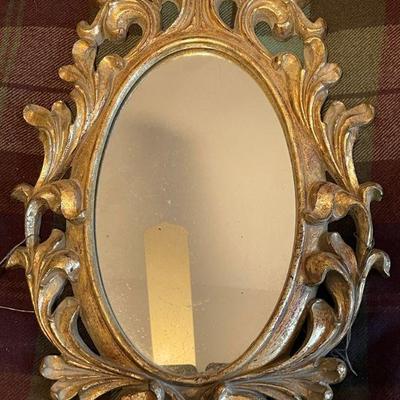 small gold framed mirror